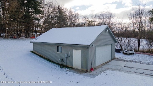 view of snow covered garage