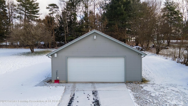 view of snow covered garage