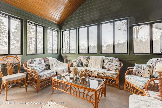 sunroom featuring vaulted ceiling and wooden ceiling