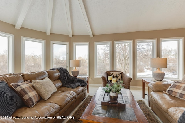 sunroom featuring vaulted ceiling with beams