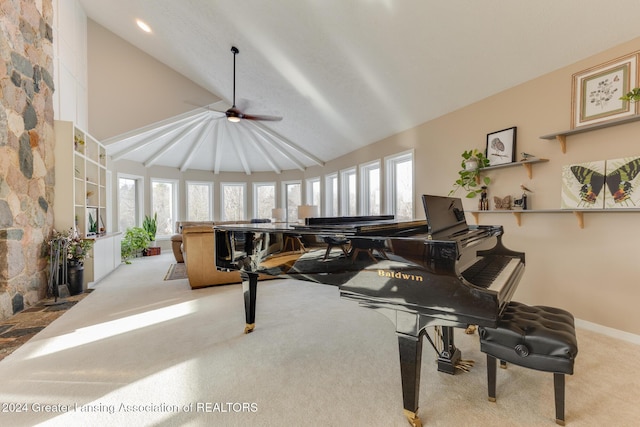 misc room with light carpet, high vaulted ceiling, and ceiling fan