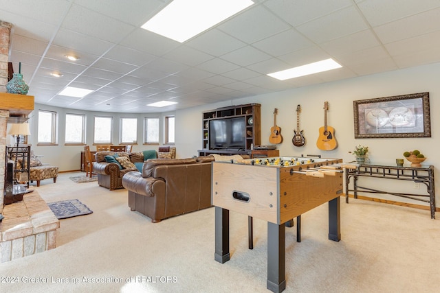 game room featuring carpet floors and a drop ceiling