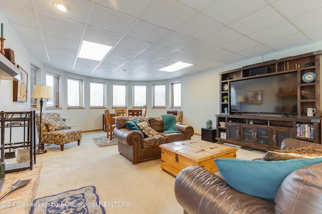 living room with light colored carpet and a drop ceiling