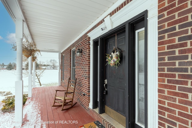 view of snow covered property entrance