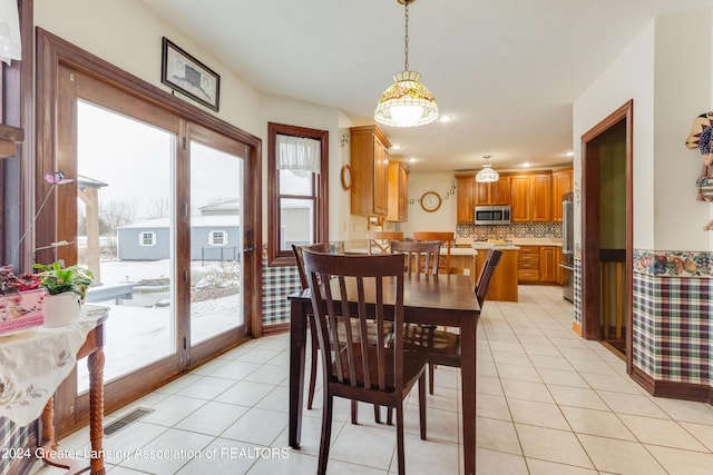 dining area with light tile patterned floors