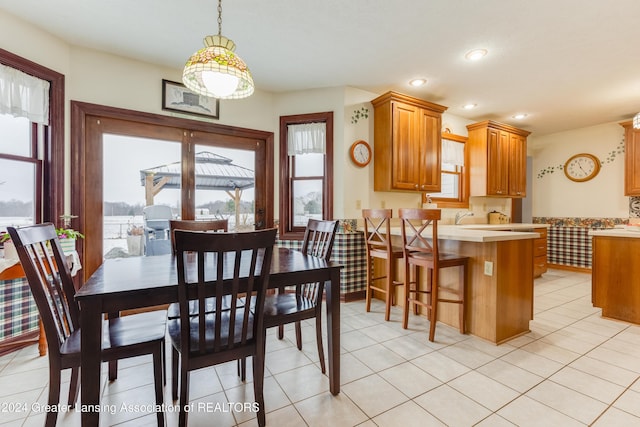 tiled dining area with sink