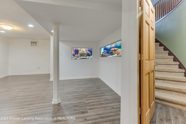 basement featuring hardwood / wood-style flooring