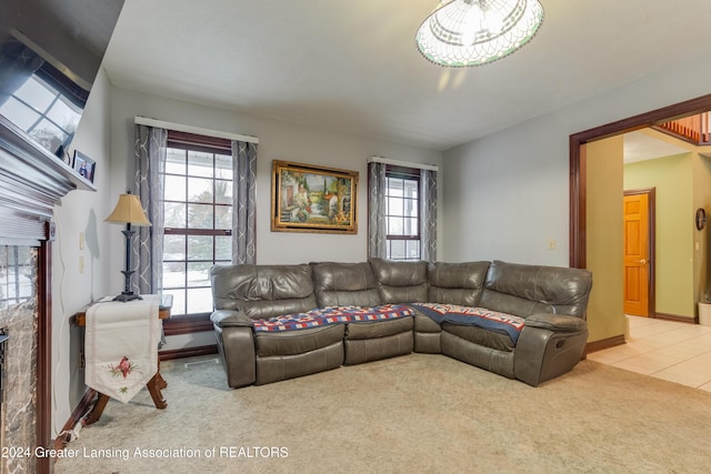 carpeted living room featuring a fireplace