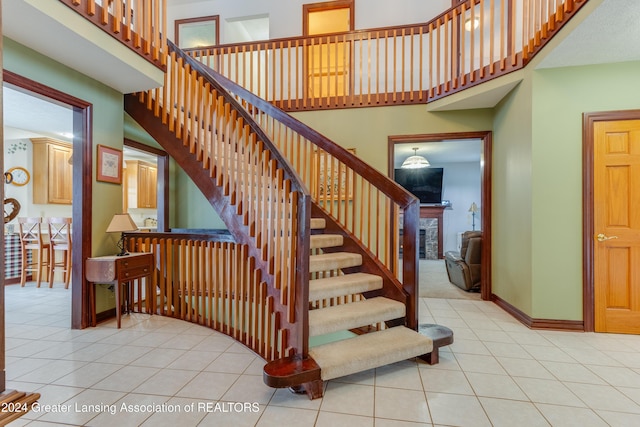 stairway with tile patterned floors