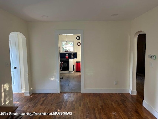 spare room featuring dark hardwood / wood-style flooring