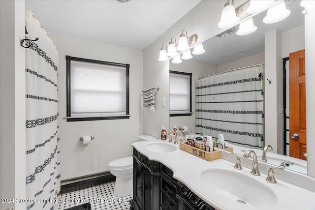 bathroom featuring curtained shower, vanity, and toilet