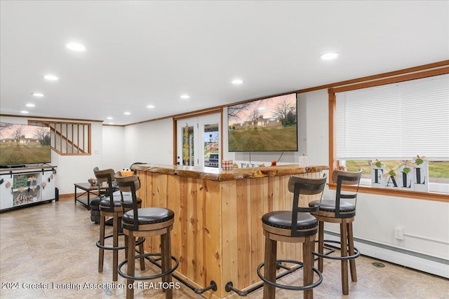 bar with crown molding and a baseboard radiator