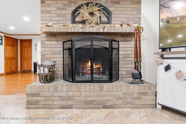 interior details with a fireplace and hardwood / wood-style flooring