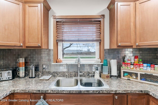 kitchen with decorative backsplash and sink