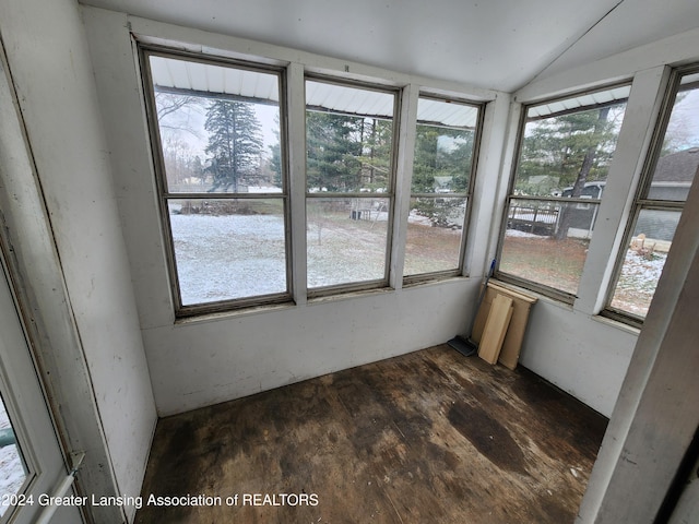 unfurnished sunroom featuring plenty of natural light and lofted ceiling