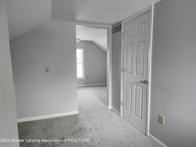 additional living space with carpet and lofted ceiling