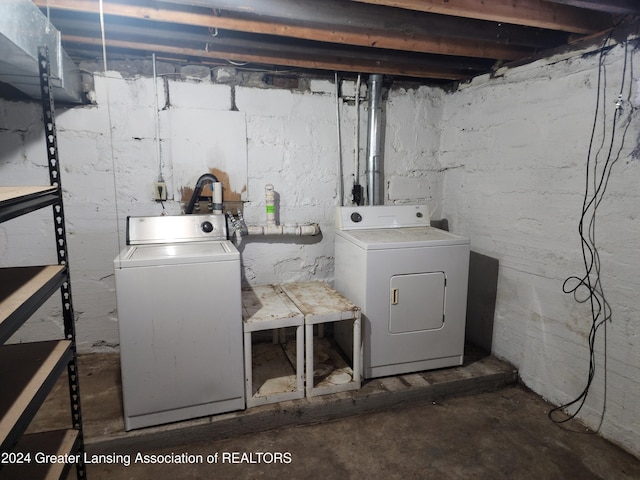 laundry area with washing machine and clothes dryer