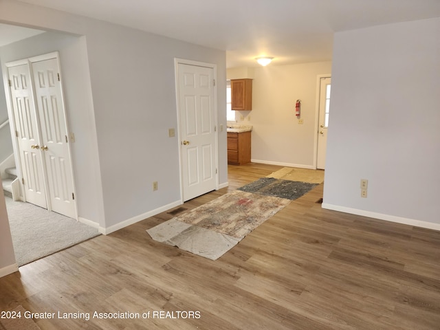 spare room featuring light wood-type flooring