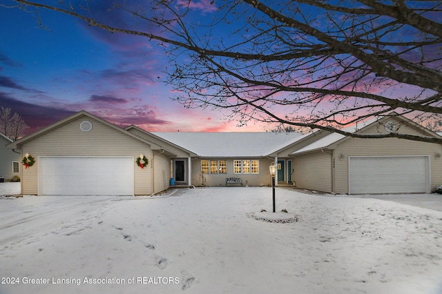 single story home featuring a garage