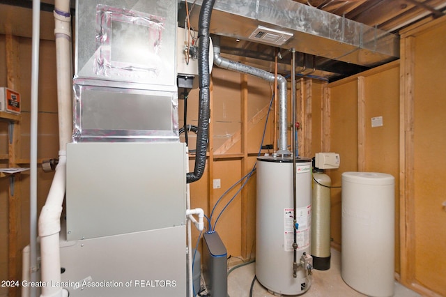 utility room featuring gas water heater