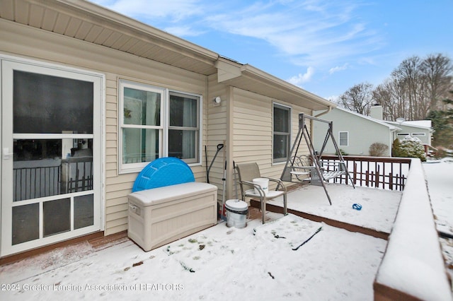 view of snow covered deck