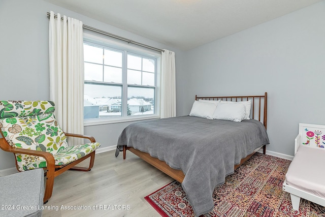 bedroom with light wood-type flooring