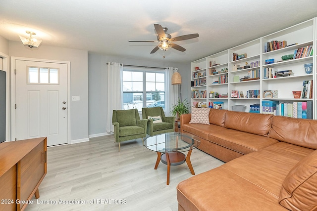 living room featuring ceiling fan and light wood-type flooring