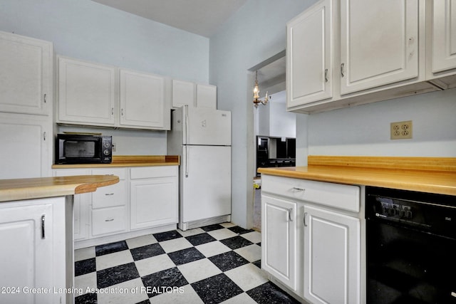 kitchen featuring black appliances, white cabinets, and hanging light fixtures