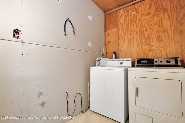 laundry area with independent washer and dryer