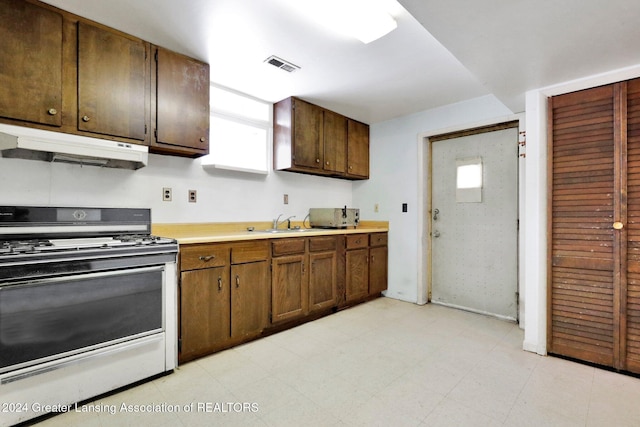 kitchen with sink and range with gas cooktop