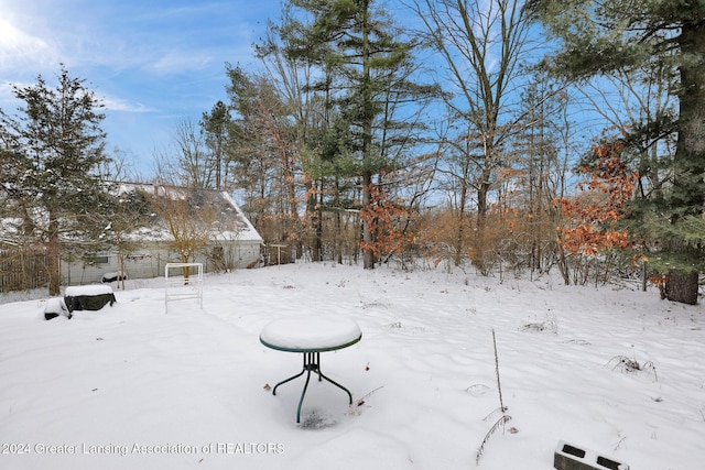 view of yard covered in snow