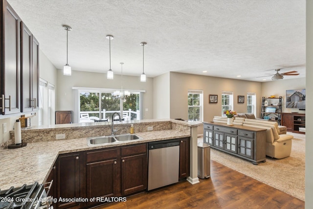 kitchen with ceiling fan with notable chandelier, sink, dark brown cabinets, and stainless steel appliances