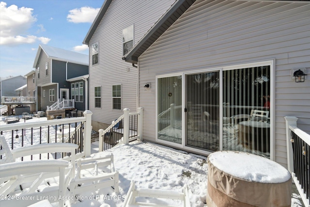 view of snow covered deck