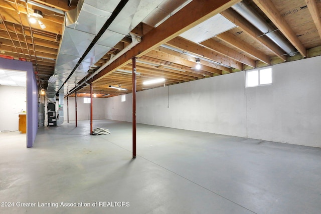 basement featuring heating unit