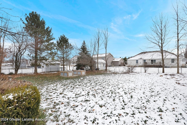 view of yard covered in snow