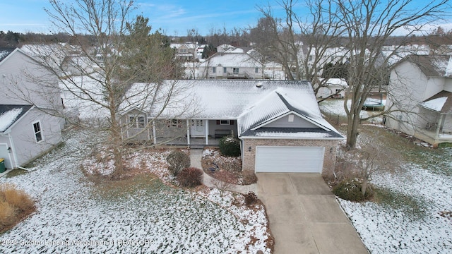 view of front of house featuring a porch and a garage