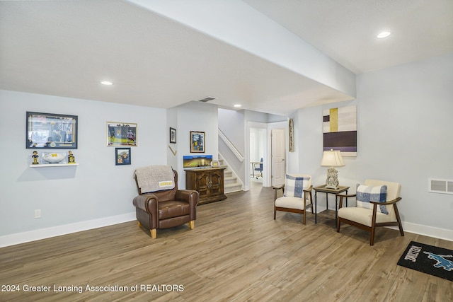 sitting room featuring light hardwood / wood-style floors