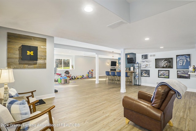 living room with light hardwood / wood-style floors