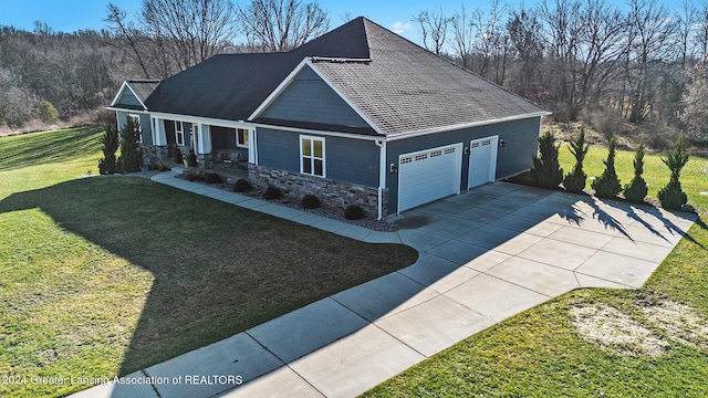 view of front of home with a front lawn and a garage