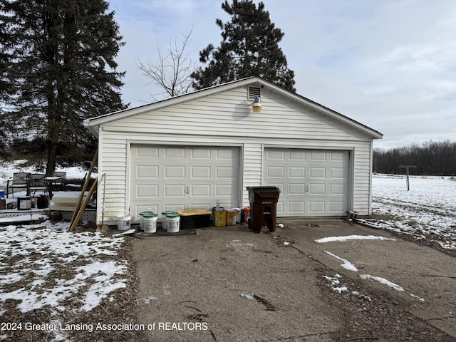 view of snow covered garage