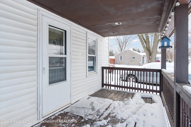 view of snow covered deck