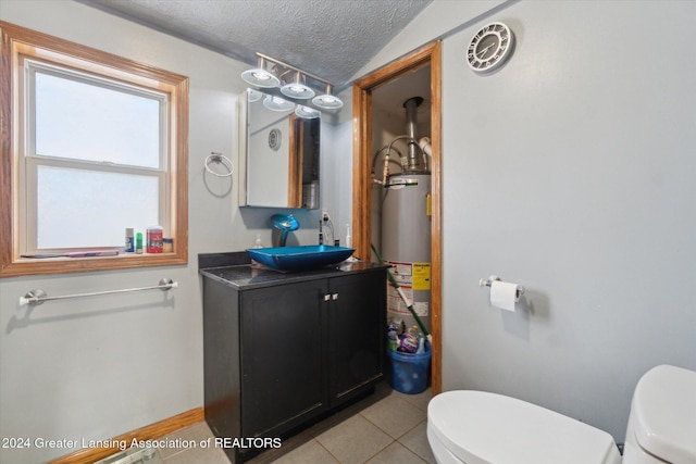 bathroom with toilet, tile patterned floors, a textured ceiling, and water heater