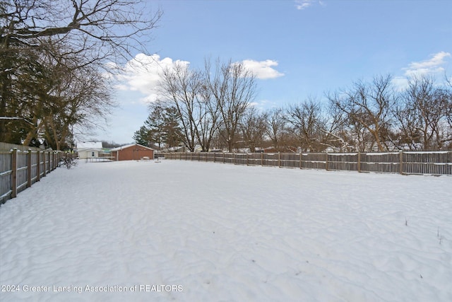 view of yard layered in snow