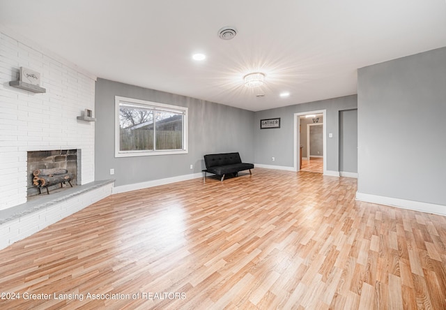 interior space with a fireplace and light hardwood / wood-style floors