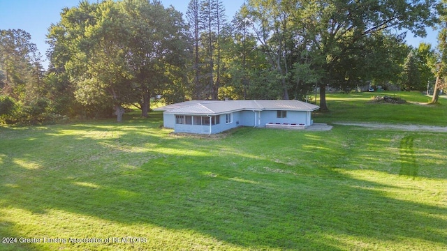 exterior space with a front lawn