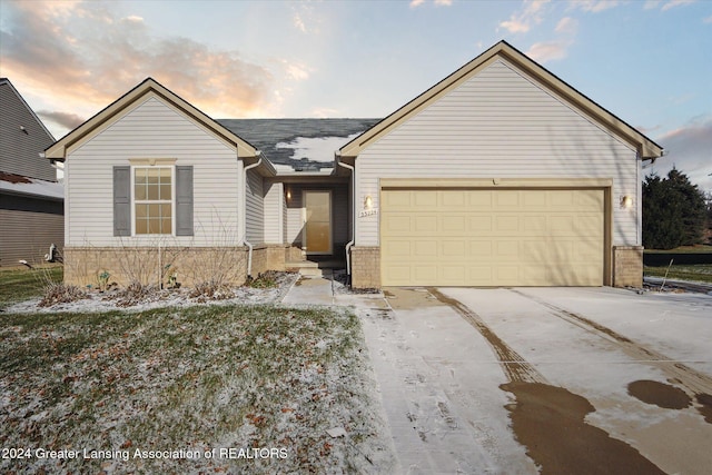 ranch-style house featuring a garage