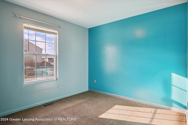 empty room featuring carpet floors