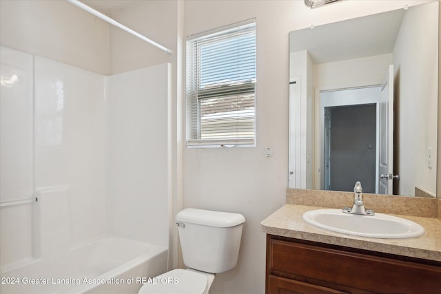 full bathroom featuring bathtub / shower combination, vanity, and toilet