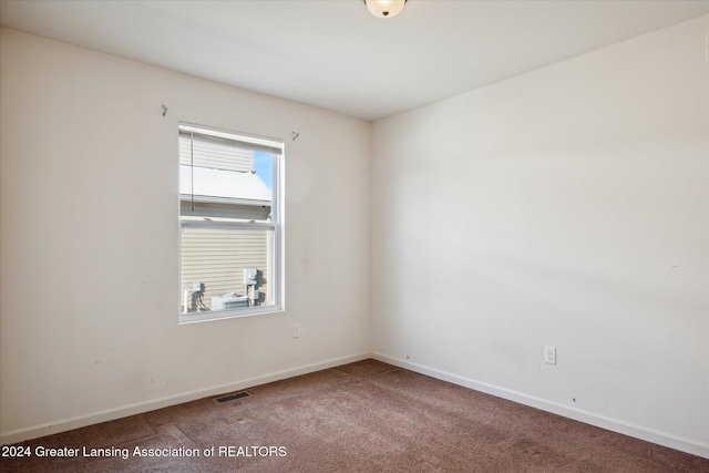 unfurnished room featuring carpet flooring