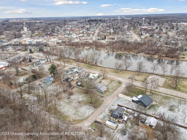 birds eye view of property with a water view